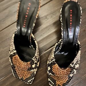 Simon Miller snakeskin slides.